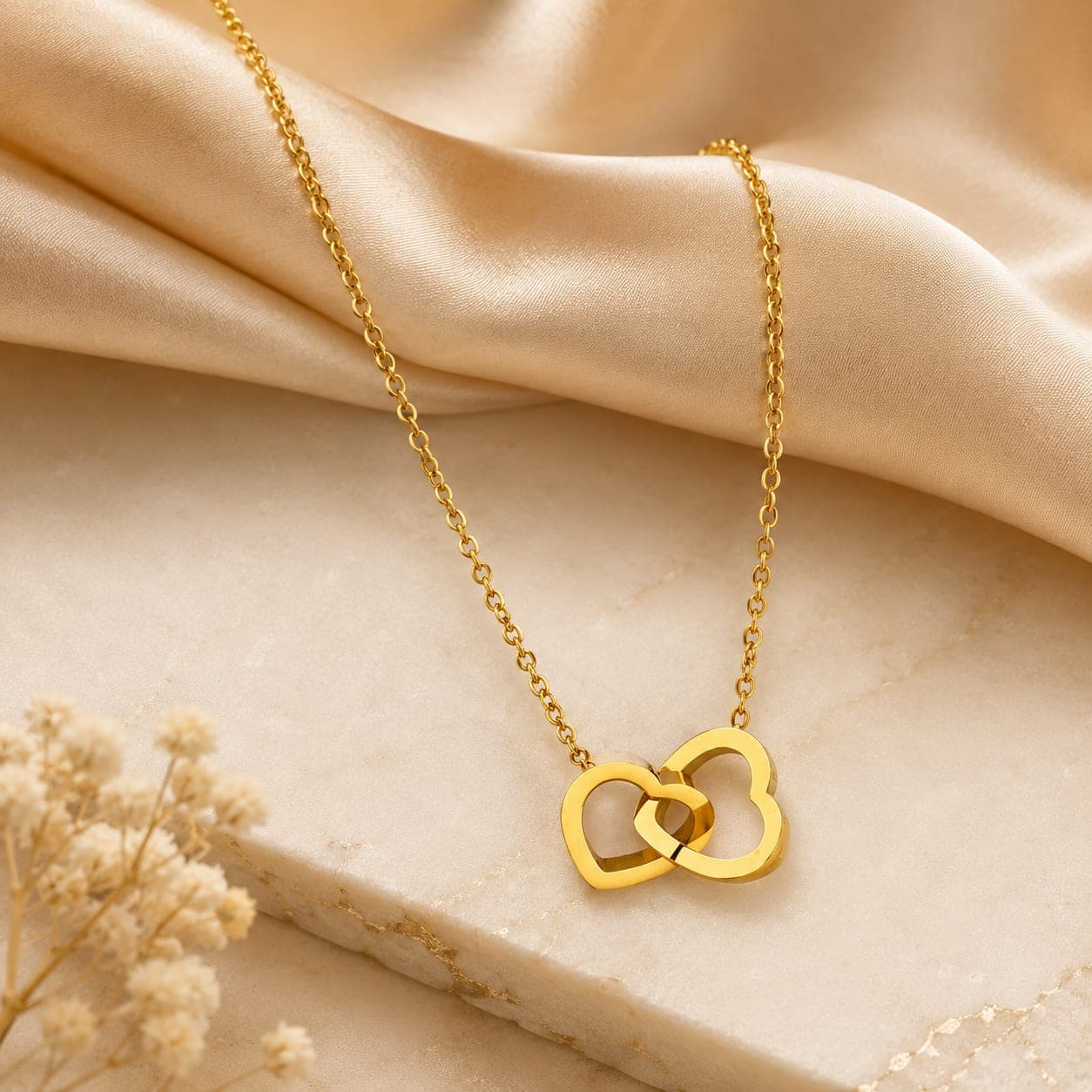 Interlocking heart pendant